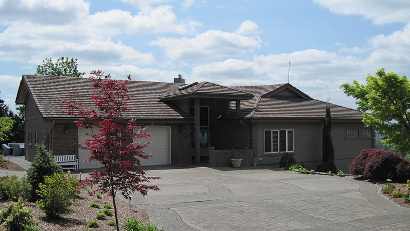 Single-story suburban house with large driveway