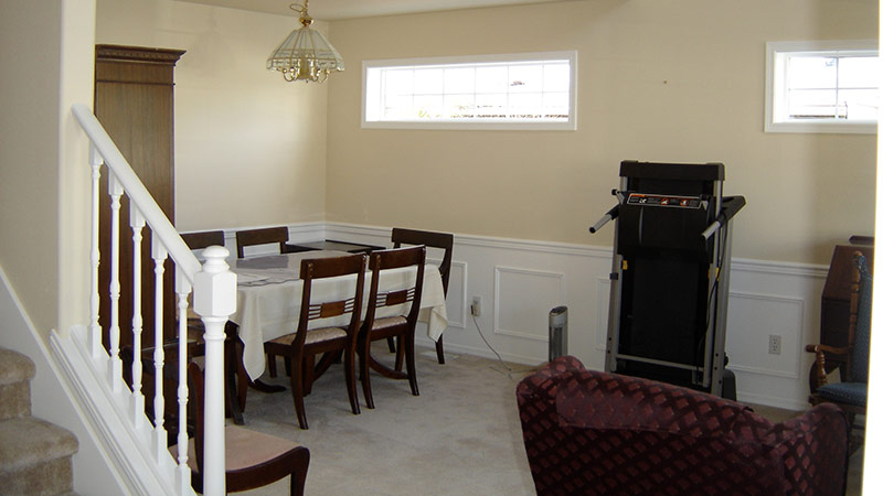 Dining table and treadmill in finished basement