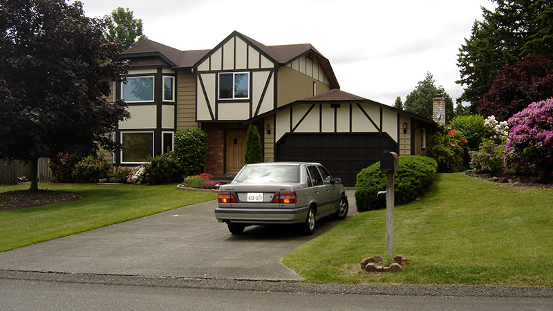 Tudor-style house with car in driveway