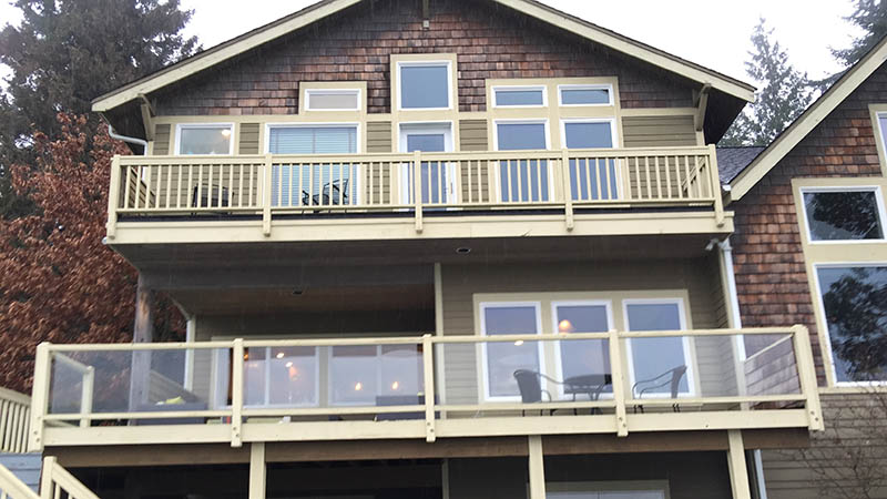 Large wooden house with two glass balconies