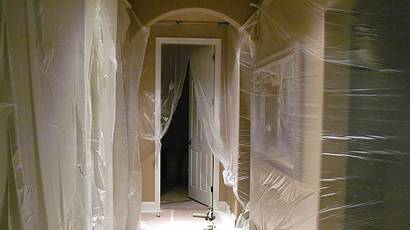 Hallway covered in plastic sheeting for renovation