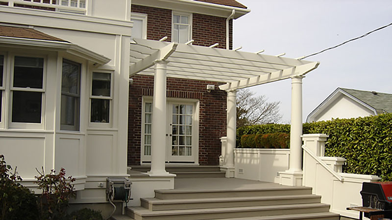 House porch with white pergola and steps