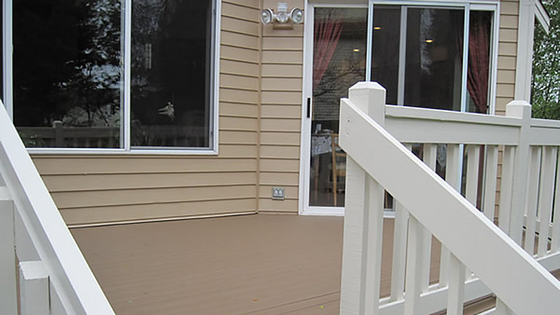 Empty residential deck with white railing