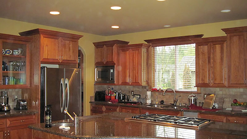 Spacious kitchen with wooden cabinets and island