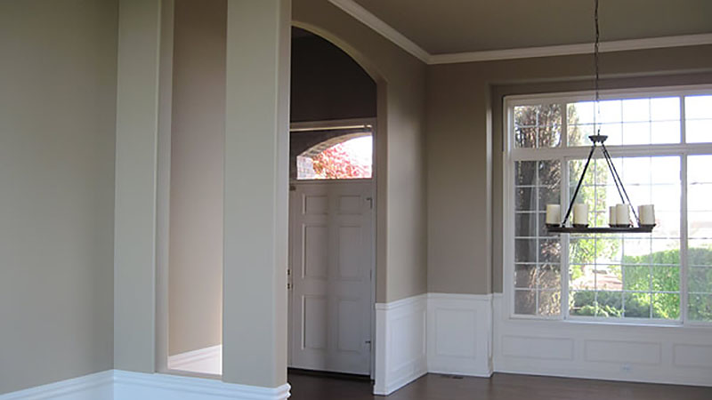 Light-filled entryway with front door and window