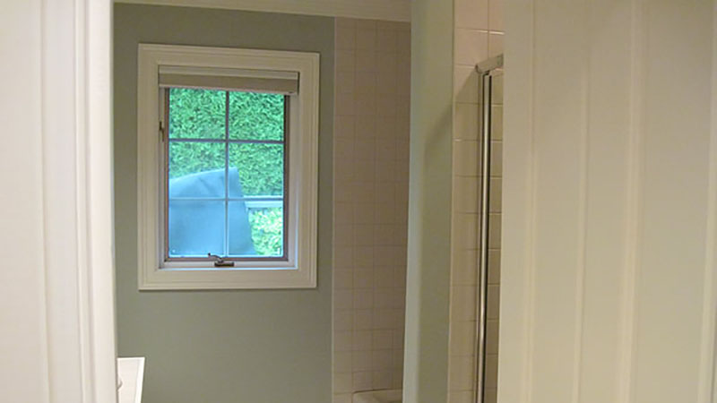 Small bathroom interior with window and shower