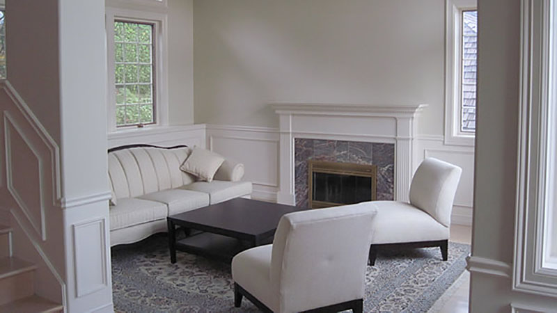 Neutral living room with fireplace and seating