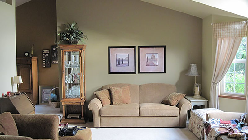 Cozy beige living room with sofa and armchairs