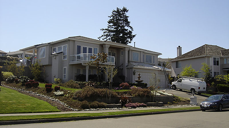 Two-story suburban house with landscaped front yard