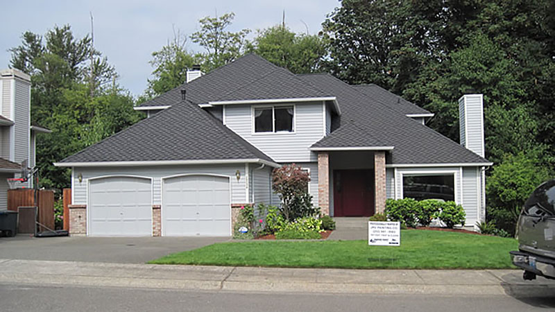 Gray two-story house with double garage