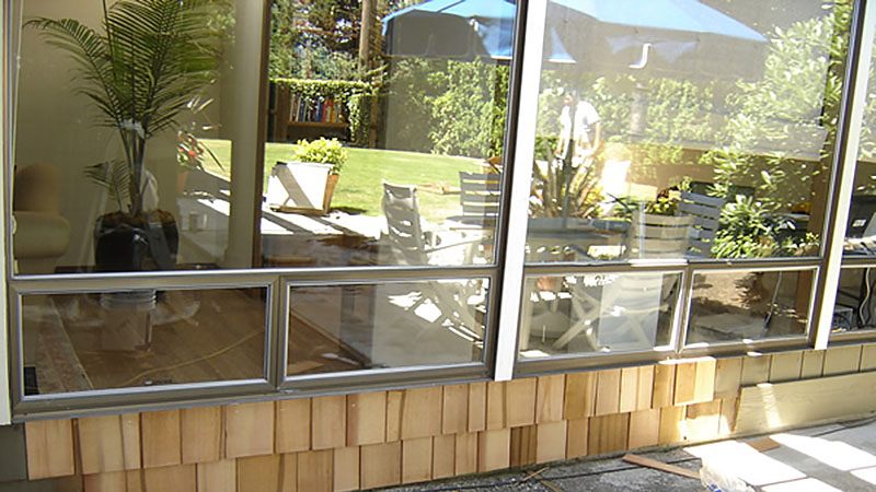 Outdoor patio reflected in sliding glass doors