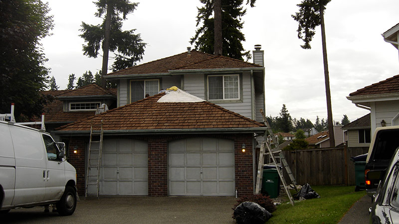 House with double garage undergoing roof repairs