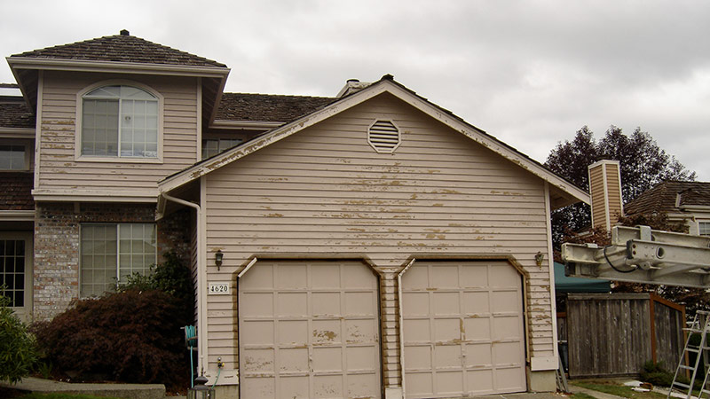 Weathered two-car garage on suburban house