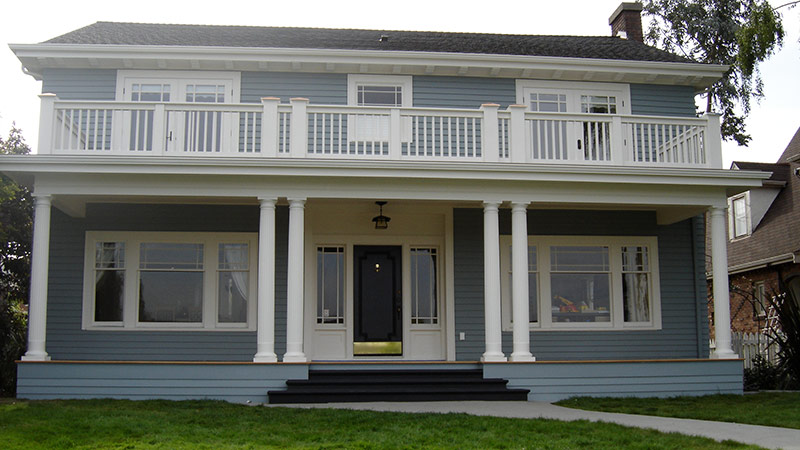 Blue two-story house with white porch