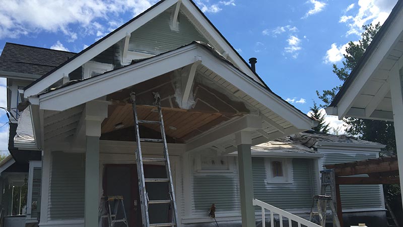 Front porch ceiling renovation with ladders