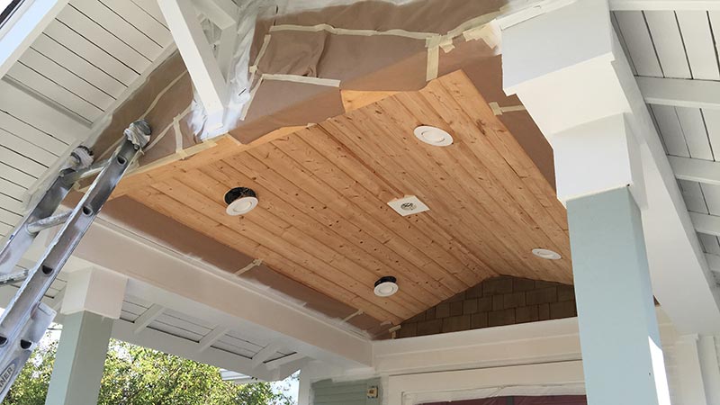 Wood porch ceiling with recessed lights