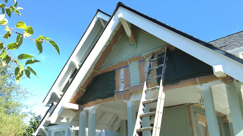 House gable under renovation with ladder
