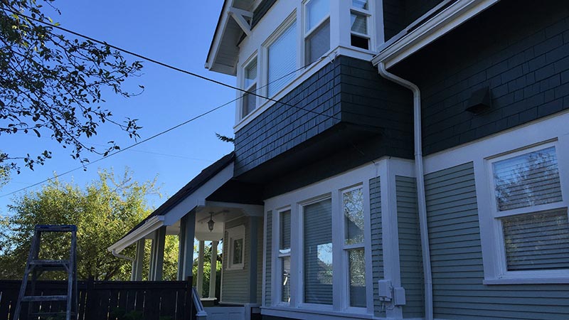 Blue-gray two-story house with porch