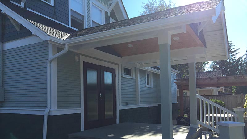 Covered front porch with double doors