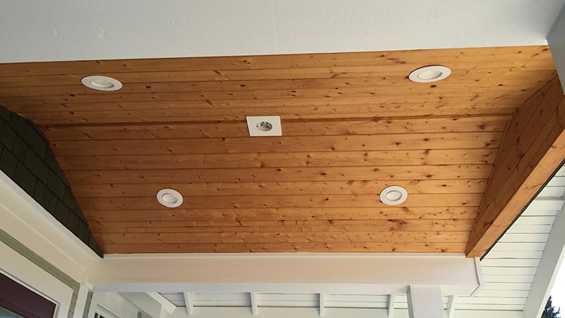 Wooden porch ceiling with recessed lights