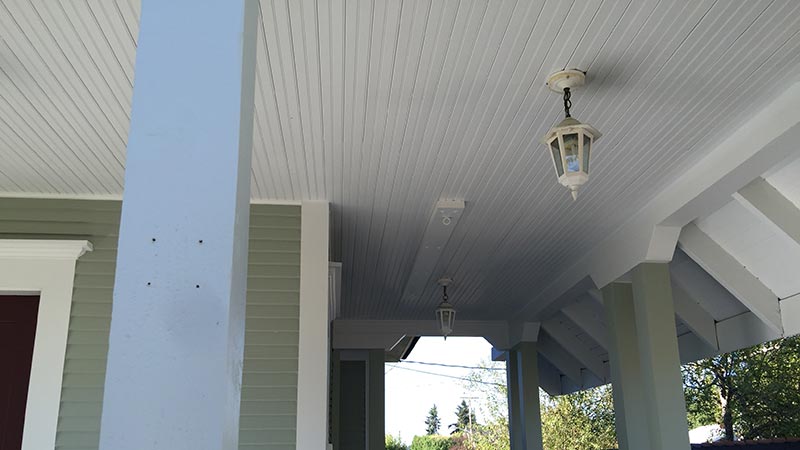 Covered porch with hanging lanterns and columns