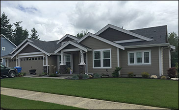 Suburban single-story house with green lawn